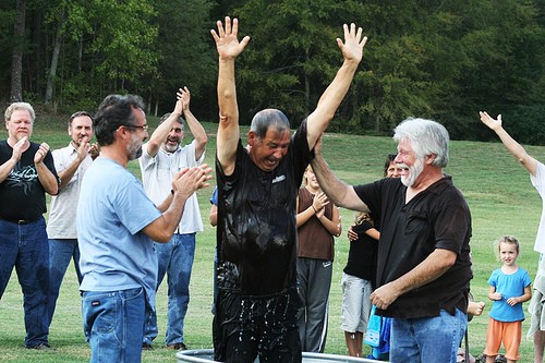 Paul Pavao baptizing Roy Pavao