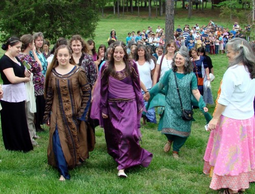 Passage welcoming two young ladies as adult members of Rose Creek Village